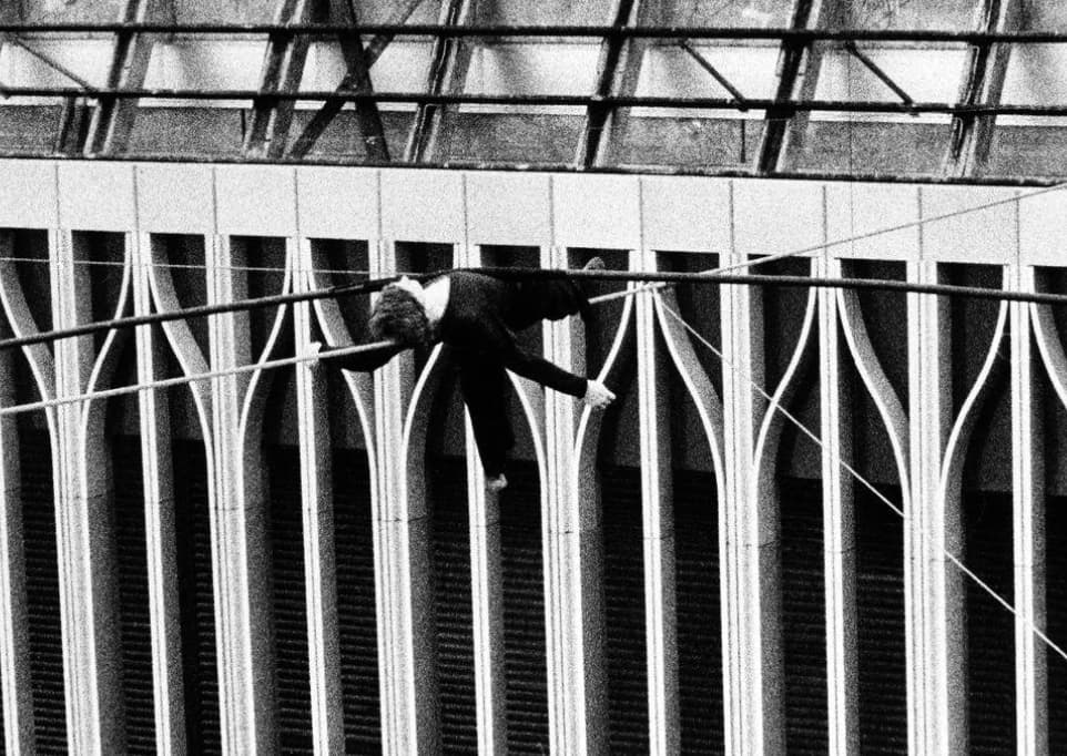 man on wire lying down